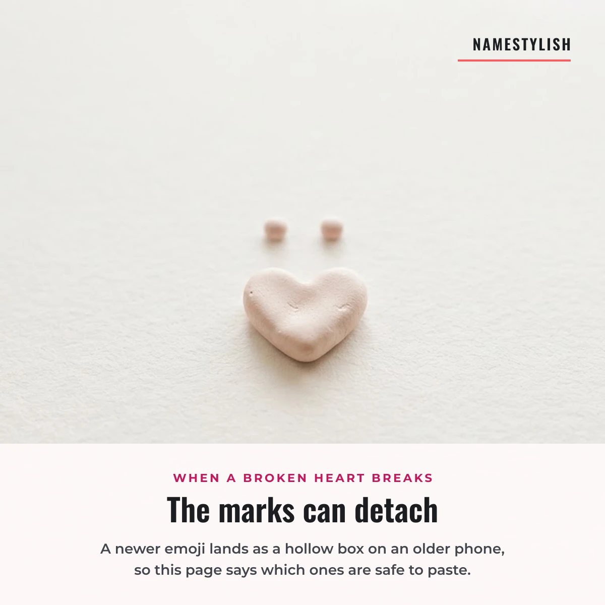 Why a sad emoji shows as a hollow box A pale ceramic heart with two small detached dots above it on white paper